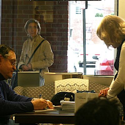 R.A. Comnale, M.D. signing books.